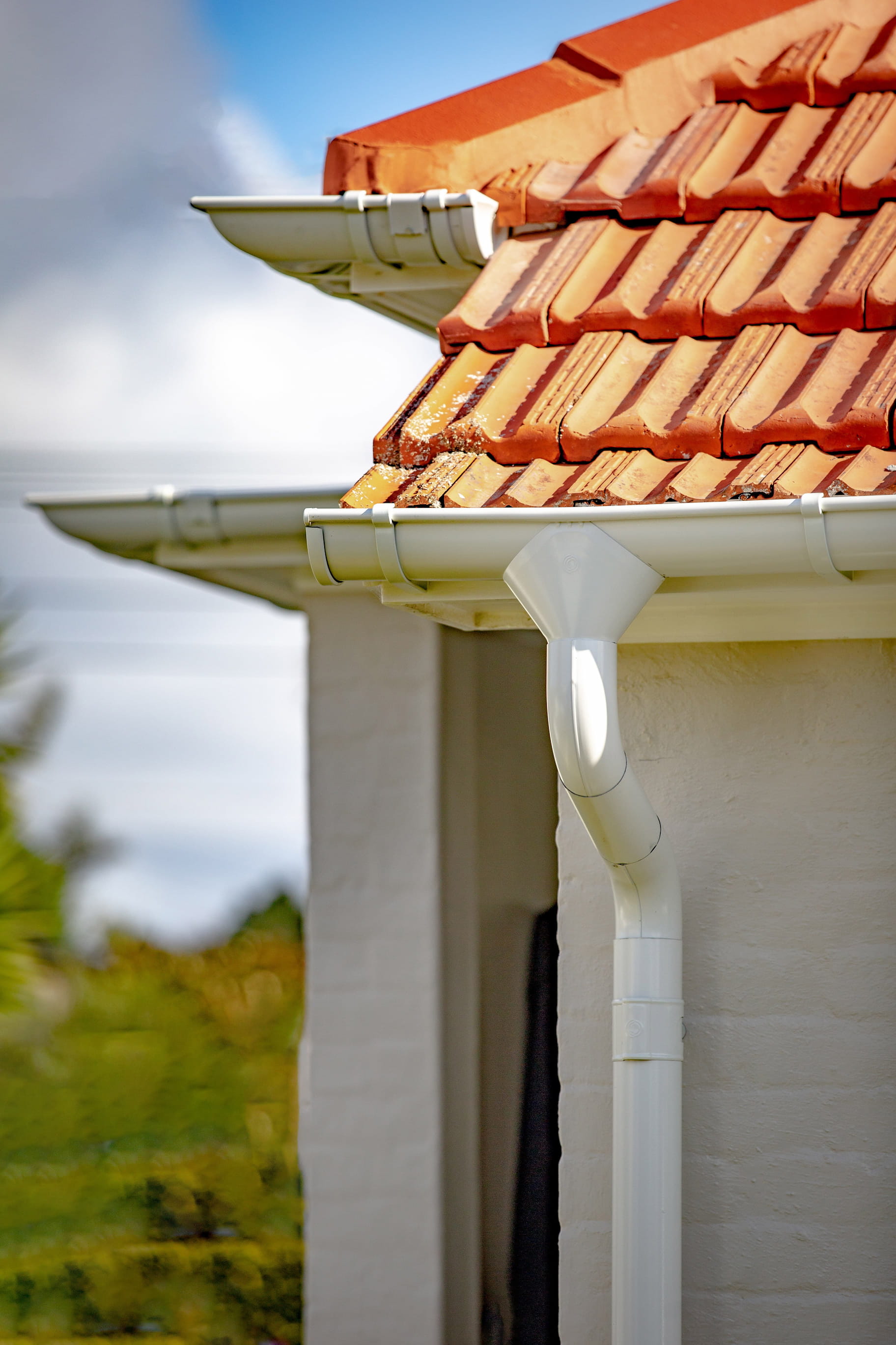 A detailed view of a roof with a Lindab gutter, designed to collect and redirect rainwater efficiently.